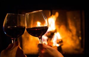 Two Wine Glasses in Front of a Fire